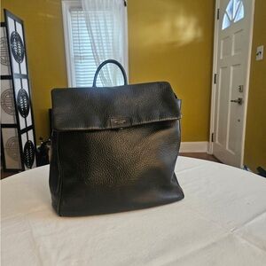 Storksak London black leather diaper bag.